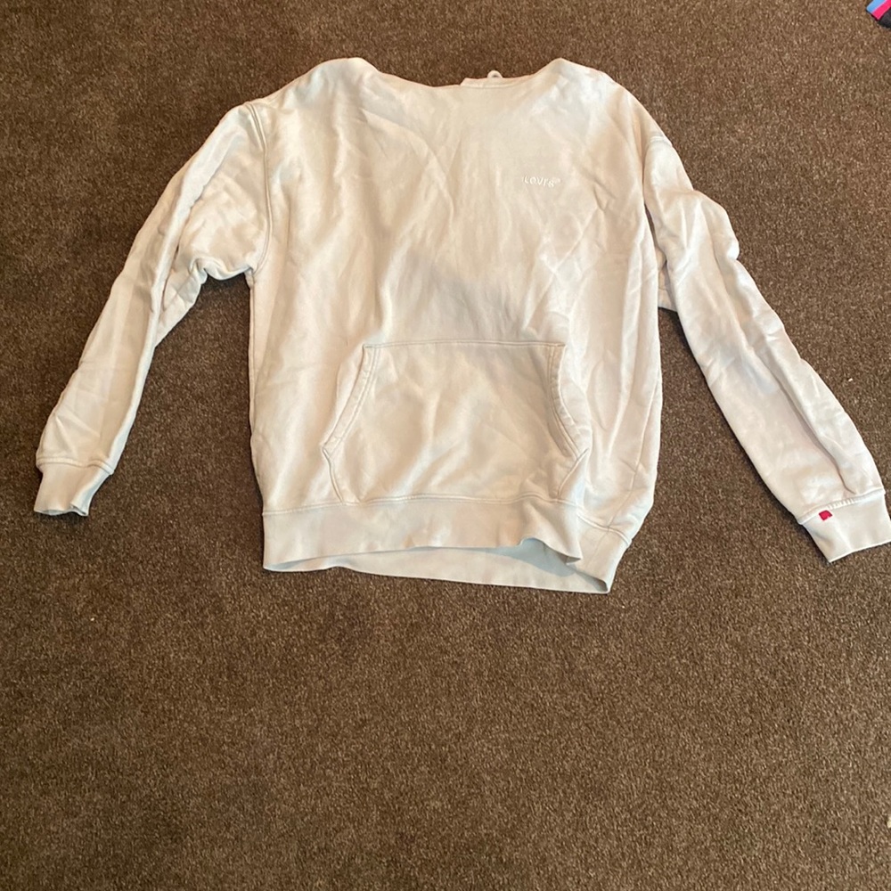 Levi’s cream and multi colored hoodie.